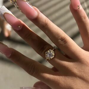 Elegant Gold and Silver Ring with Crystal